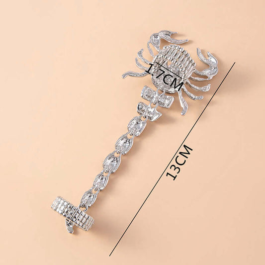 Make a statement with this silver-tone scorpion piece, blending punk, vintage, and hip hop styles. Crafted with rhinestones, zinc alloy, and an elastic band