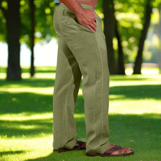 Men's drawstring elastic waist trousers in olive green, ideal for a comfortable outdoor look on a sunny day.