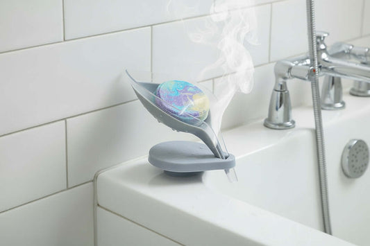 Soap & Shower Steamer Holder with steamer on bathtub edge, showcasing elegant design and practical functionality.