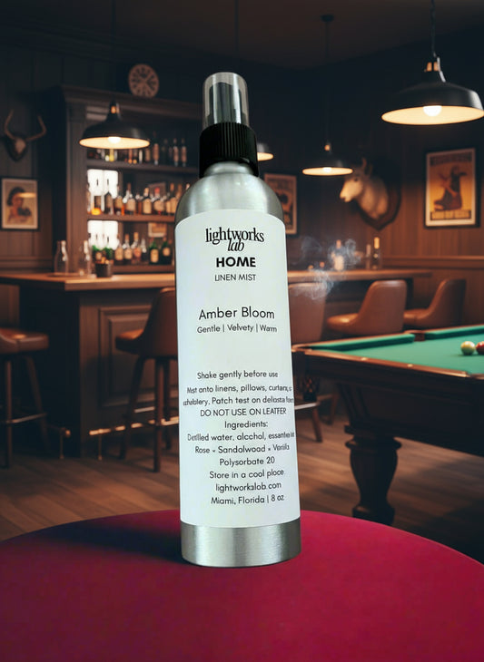 Silver bottle with a label on a beige fabric background