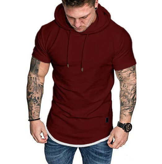 Men's Solid Color Hooded T-shirt in burgundy worn by a man with tattoos, perfect for casual outings and laid-back comfort.