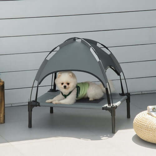Elevated Portable Pet Bed With UV Protection Canopy Shade. Ideal for outdoor use, this bed provides comfort and protection from the sun to any small pet.