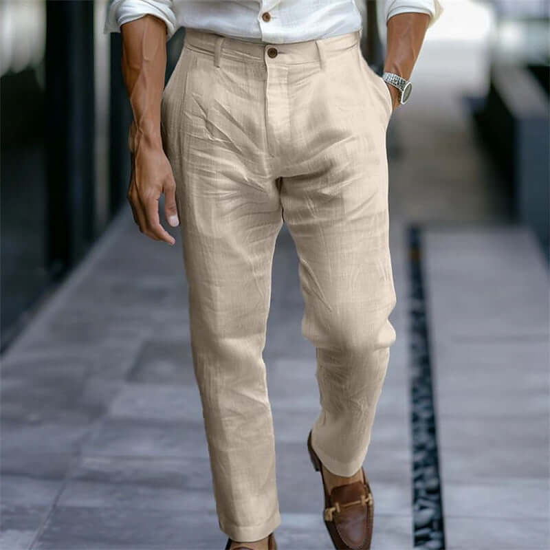 Beige pants worn by a person on a blurred background