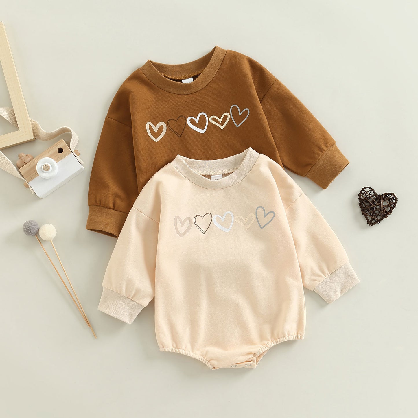 Get ready to fall in love with this cute Children's Love Embroidered One-piece Long Sleeve Romper! It's perfect for autumn days, whether your little one is indoors or outdoors. Made of soft cotton, it's perfect for any occasion - it's simply adorable! Acc