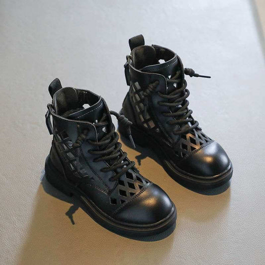 Girl's trendy black short boots with lace-up design and cut-out details for stylish comfort.