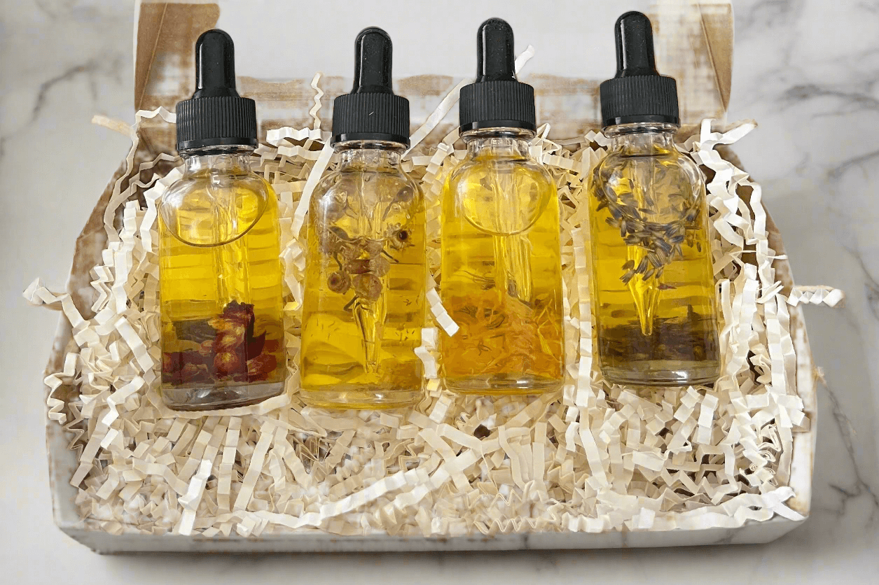 Botanical Dry Body Oil Sampler Set 4x1 oz featuring four handcrafted oil bottles in a recyclable Kraft box.