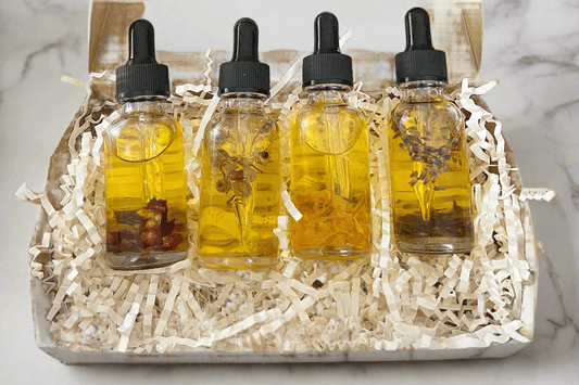 Botanical Dry Body Oil Sampler Set 4x1 oz featuring four handcrafted oil bottles in a recyclable Kraft box.