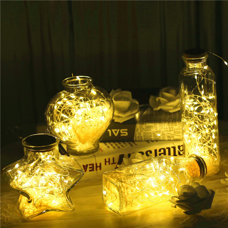 Illuminate your space with our versatile Glass bottle with gypsophila lights. Choose from 4 shapes, 3 lighting moods, soft, white, or multi colored. Mix and match to create your own unique design. Perfect for both indoor and outdoor use, this all-in-one L