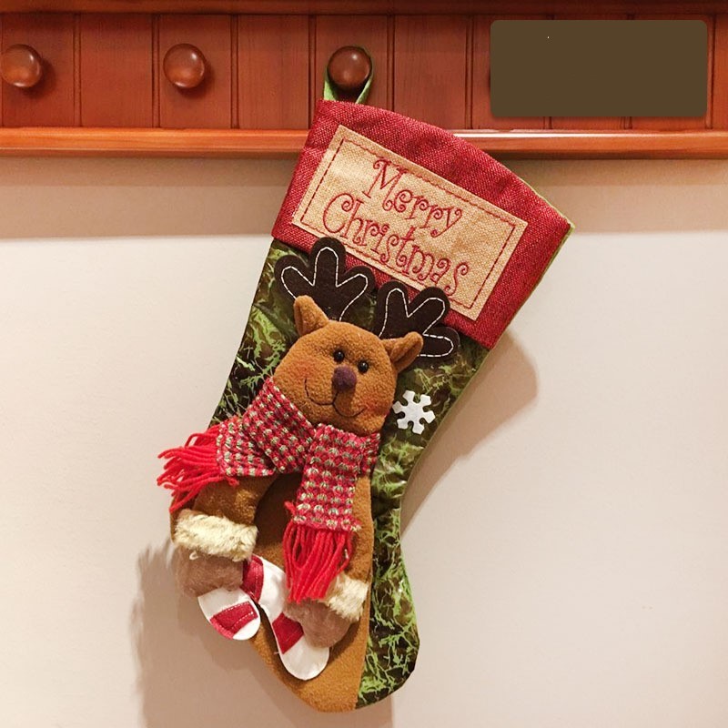 Add a touch of winter wonderland to your holiday decor with this Christmas stocking featuring charming reindeer, Santa, and snowman designs. Beautifully crafted to adorn your mantle or hang from your tree, this stocking is a must-have for a luxurious and