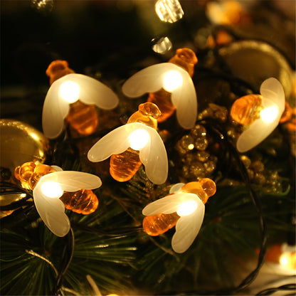 Illuminate your garden and bring warmth to your outdoor spaces with these beautiful bee solar string lights. Perfect for adding a cozy touch to your home, these lights create a festive and magical atmosphere.