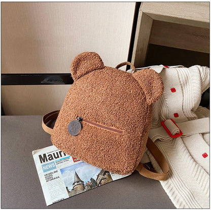 Get ready to snuggle up with this adorable Mini Backpack! Featuring a fluffy lamb design and a single strap, this cozy bag is perfect for fall and winter. Don't miss out on adding this must-have one-shoulder messenger bag to your collection! For girls & f