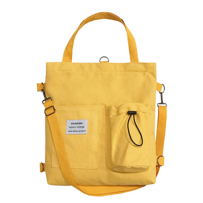 This Compact Canvas bag is a real multi-tasker - carry it in hand, wear it as a backpack, or sling it over one shoulder! Don't be fooled by its size, it can hold more than meets the eye.