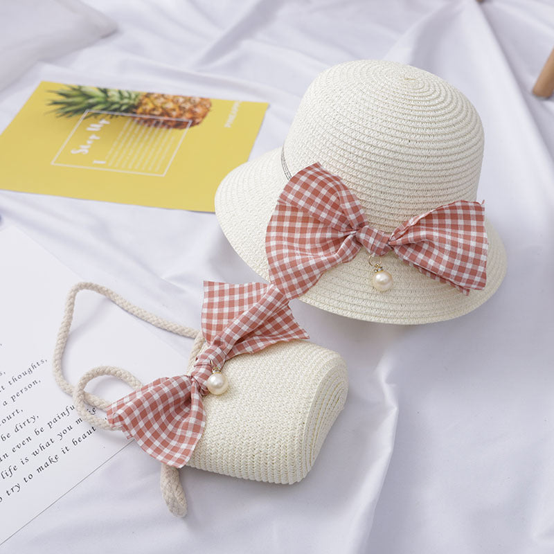 Dress to impress with this absolutely darling straw hat and purse set, featuring a charming bow and a pearly touch! Perfect for a day out with the 'rents or playtime dress-up. You'll never run out of occasions to show off your stylish side! Size Applicabl