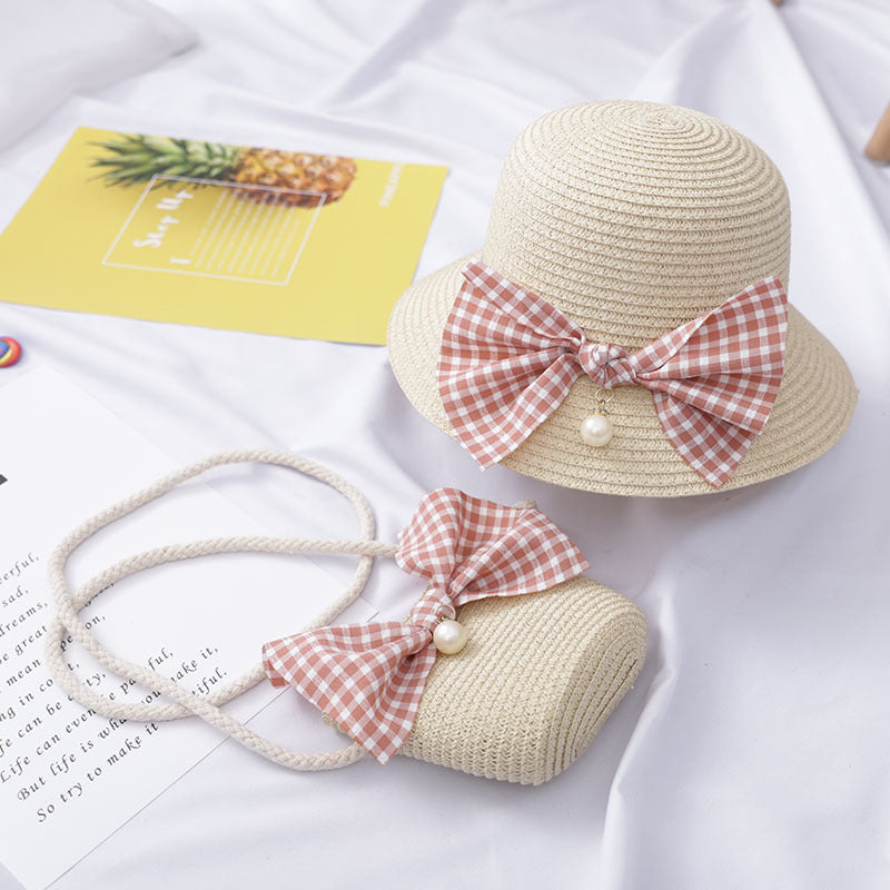 Dress to impress with this absolutely darling straw hat and purse set, featuring a charming bow and a pearly touch! Perfect for a day out with the 'rents or playtime dress-up. You'll never run out of occasions to show off your stylish side! Size Applicabl