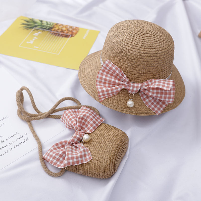 Dress to impress with this absolutely darling straw hat and purse set, featuring a charming bow and a pearly touch! Perfect for a day out with the 'rents or playtime dress-up. You'll never run out of occasions to show off your stylish side! Size Applicabl