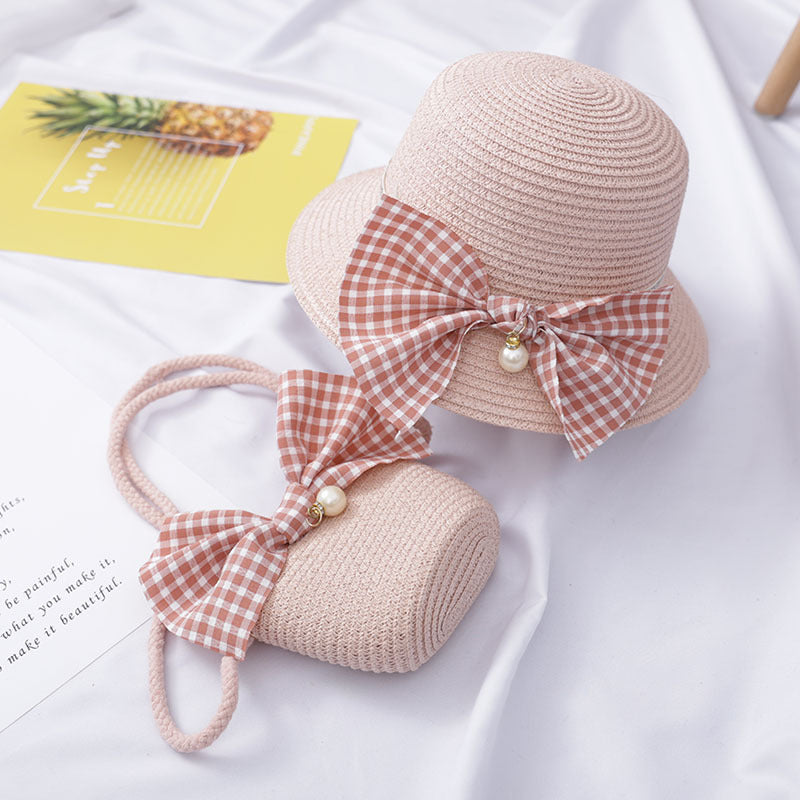 Dress to impress with this absolutely darling straw hat and purse set, featuring a charming bow and a pearly touch! Perfect for a day out with the 'rents or playtime dress-up. You'll never run out of occasions to show off your stylish side! Size Applicabl