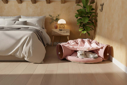 Portable Small Pet Tunnel-Bed - Ferrets Rabbit Cat Mini Pig Bed nestled in a cozy bedroom setting with a cat resting inside.