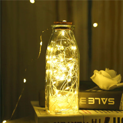 Illuminate your space with our versatile Glass bottle with gypsophila lights. Choose from 4 shapes, 3 lighting moods, soft, white, or multi colored. Mix and match to create your own unique design. Perfect for both indoor and outdoor use, this all-in-one L