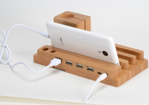 1. Made of Bamboo Wood 2. Versatile Wood Bamboo Cell Phone Tablet Stand 3. 4 USB Ports Available 4. Approximated Size: 185x110x 80mm 5. Multi-functional: Holder for iPhone 5 5s se/6 6s 7/ 6 6s 7 Plus, Charging Base for Apple Watch, Desk Stand for iPad min