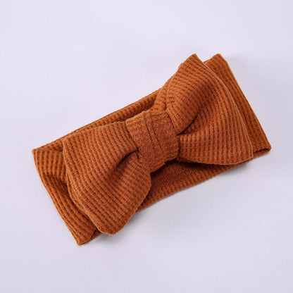 Children's Waffle Knit Oversized Bow Headband in rust color, soft and cozy for kids' everyday wear.