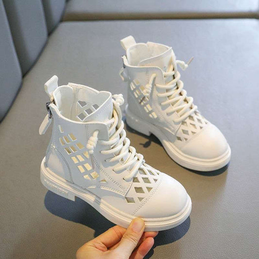 White girl's trendy short boots with cutout design and laces, perfect for stylish outings and adventures.