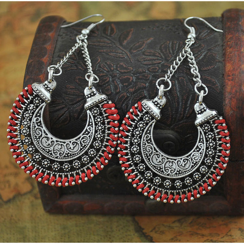 Sparkle and shine with these intricate, hand-woven, metal hollow earrings in the shape of a meniscus flower basket. Add the perfect touch of bohemian, surfer, hippie style to your look and feel the fun and beauty of these unique U-shaped earrings.