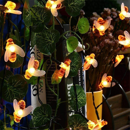 Illuminate your garden and bring warmth to your outdoor spaces with these beautiful bee solar string lights. Perfect for adding a cozy touch to your home, these lights create a festive and magical atmosphere.