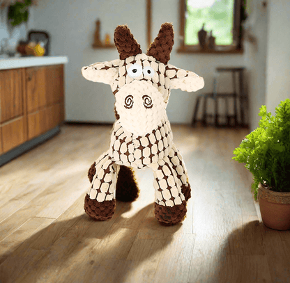 Squeaky Corduroy Chew Toys For Dogs - plush goat toy in a cozy living room setting.