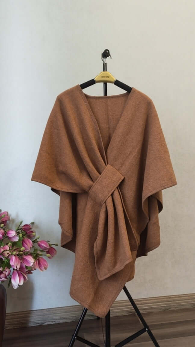 Women's Cotton Twill Cardigan Cape And Shawl in a warm brown color, displayed elegantly on a hanger.