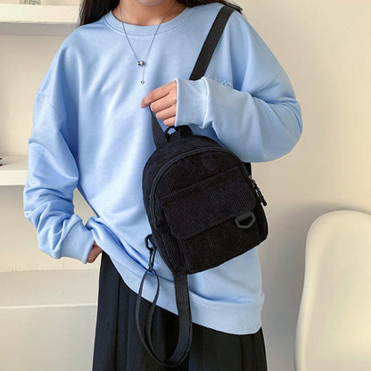 As a passionate believer in our product's value, I highly recommend this backpack for any occasion, whether it be for back to school or everyday use. The cute corduroy design adds a touch of quirkiness to your style, making you stand out with enthusiasm a