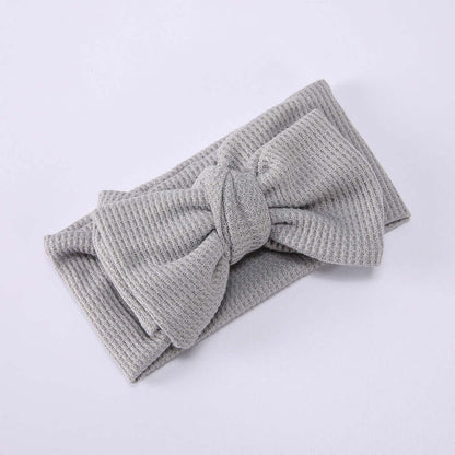 Children's Waffle Knit Oversized Bow Headband in soft grey fabric with oversized bow design.