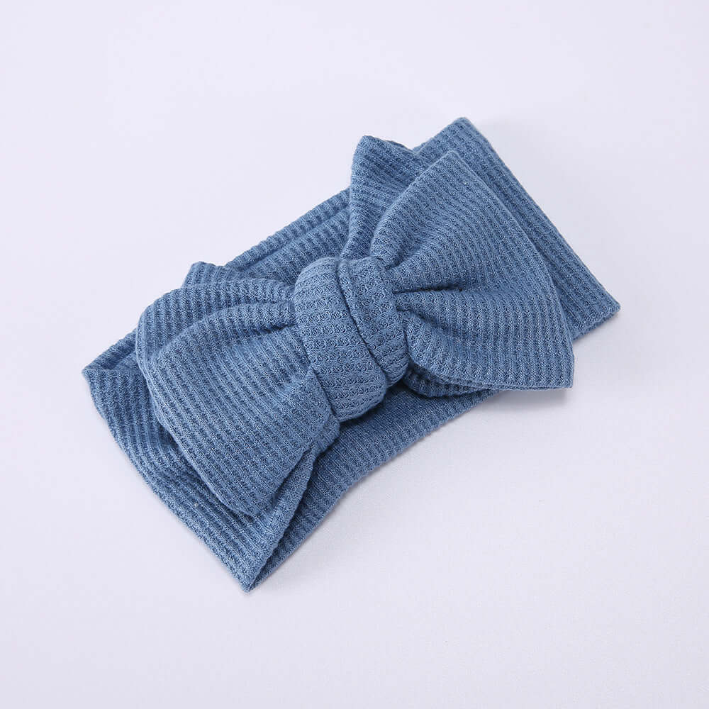 Children's Waffle Knit Oversized Bow Headband in blue, crafted from soft waffle knit fabric.