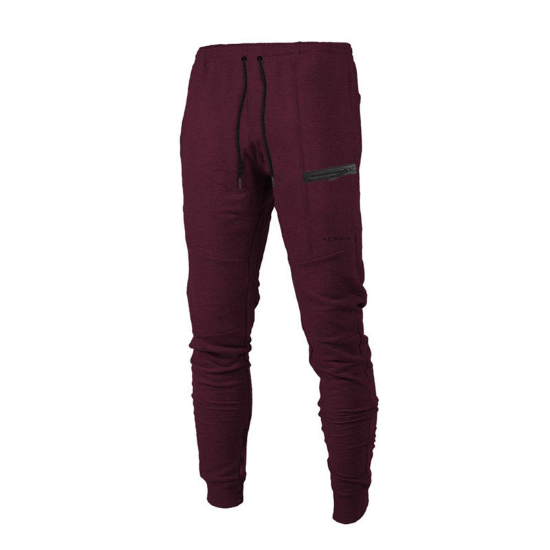 Indulge in pure comfort with our Men's leisure pants, crafted from soft cotton and designed with an elastic waist and drawstring closure for a perfect fit. With a sleek solid color and relaxed silhouette, these pants also feature ribbed elastic cuffs and