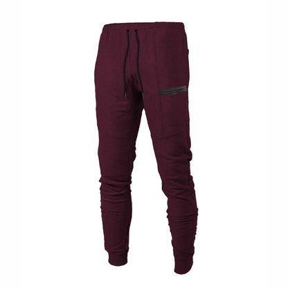 Indulge in pure comfort with our Men's leisure pants, crafted from soft cotton and designed with an elastic waist and drawstring closure for a perfect fit. With a sleek solid color and relaxed silhouette, these pants also feature ribbed elastic cuffs and