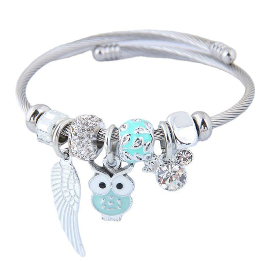 Product information： These stunning Owl & Angel Wings Charm Bracelets come in 5 different colors to fit any style! Made with high-quality steel alloy, sparkling rhinestones, and a variety of charming colors, this accessory is truly one-of-a-kind and will