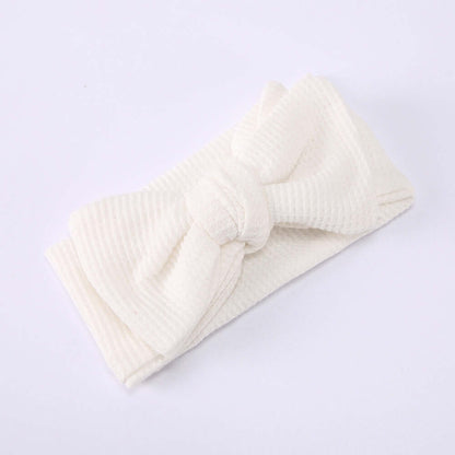 Children's Waffle Knit Oversized Bow Headband in soft white fabric, perfect for little girls' stylish outfits.
