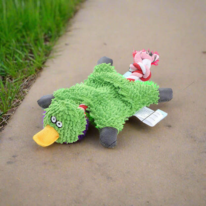 Squeaky Corduroy Chew Toys For Dogs in a fun green duck design, perfect for pet playtime outdoors.