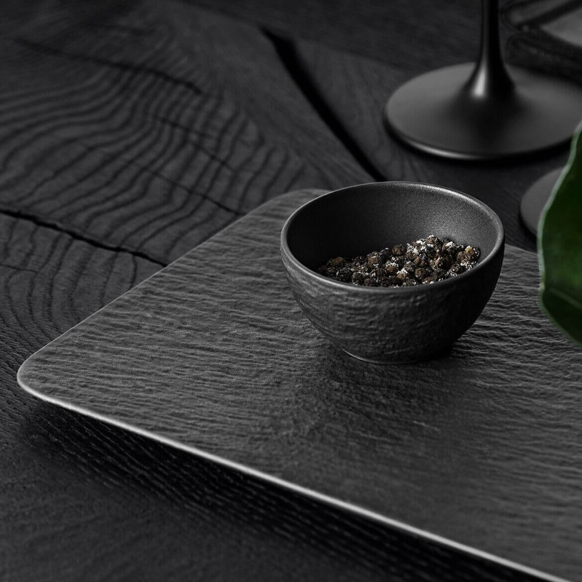 Villeroy & Boch Manufacture Rock Glow 3 Piece Condiment Set, Premium Porcelain, Made in Germany featuring a black bowl with spices.