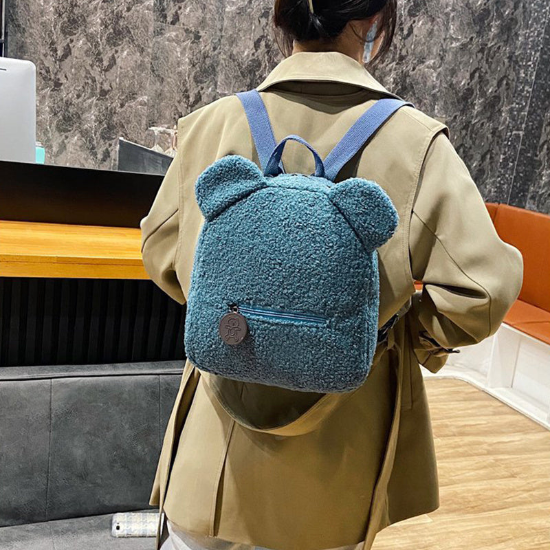 Get ready to snuggle up with this adorable Mini Backpack! Featuring a fluffy lamb design and a single strap, this cozy bag is perfect for fall and winter. Don't miss out on adding this must-have one-shoulder messenger bag to your collection! For girls & f