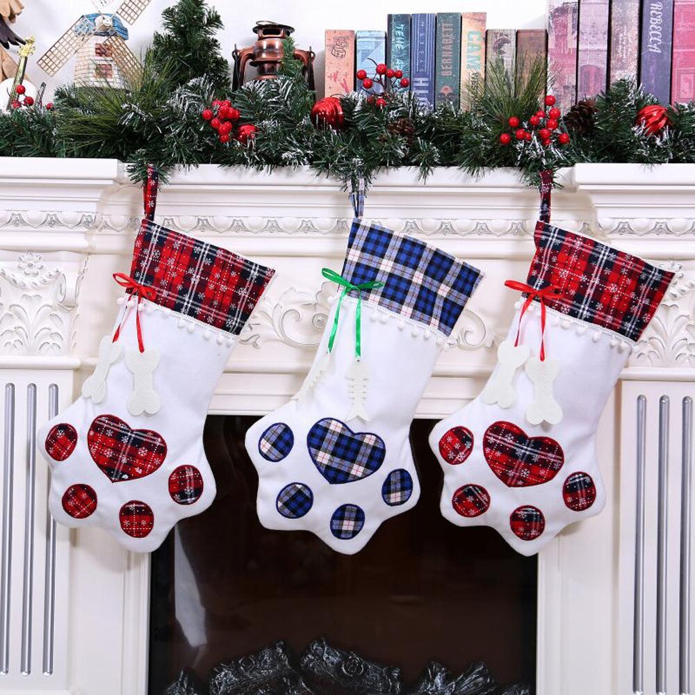 Plaid Paw Stockings - Perfect for including your furry companions in the spirit this Christmas season! Spaciously sized to hold their favorite bones, treats, and toys. Choose from festive red or royal blue. Crafted by hand with care. Available in gingham