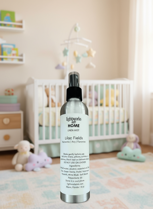 Lightworks lab HOME linen mist bottle with a child playing in the background