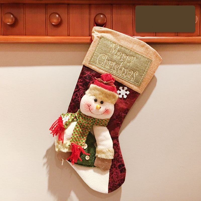 Add a touch of winter wonderland to your holiday decor with this Christmas stocking featuring charming reindeer, Santa, and snowman designs. Beautifully crafted to adorn your mantle or hang from your tree, this stocking is a must-have for a luxurious and
