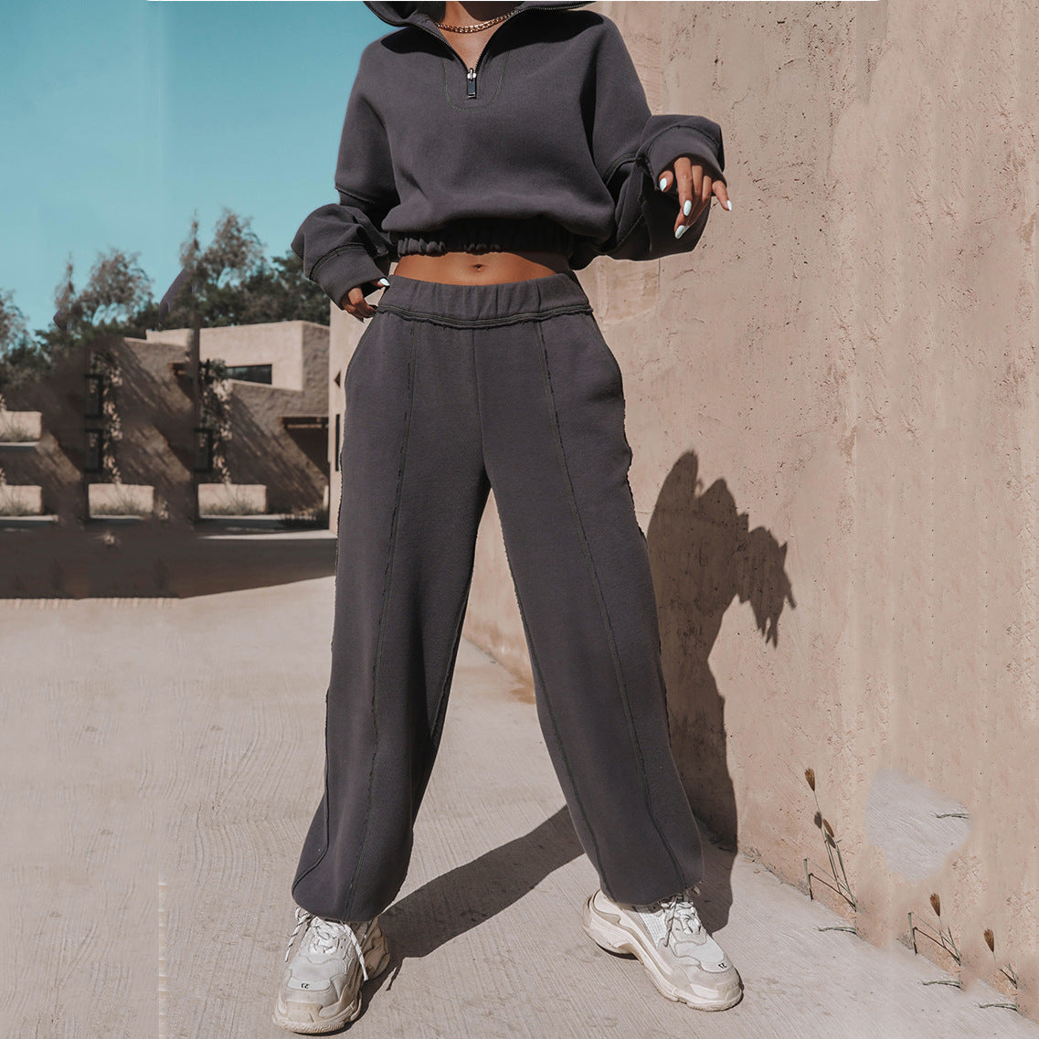 Active women's sweatshirt and pant set in trendy dark color, perfect for casual events and cozy fit.