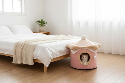 Ice Cream House Pet Bed in soft pink, providing a cozy retreat for small pets near a bed in a bright room.