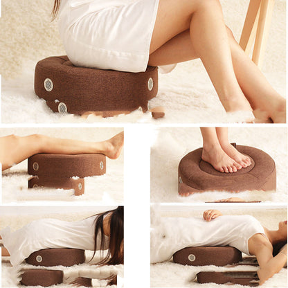 Brown footrest being used by a person on a white surface