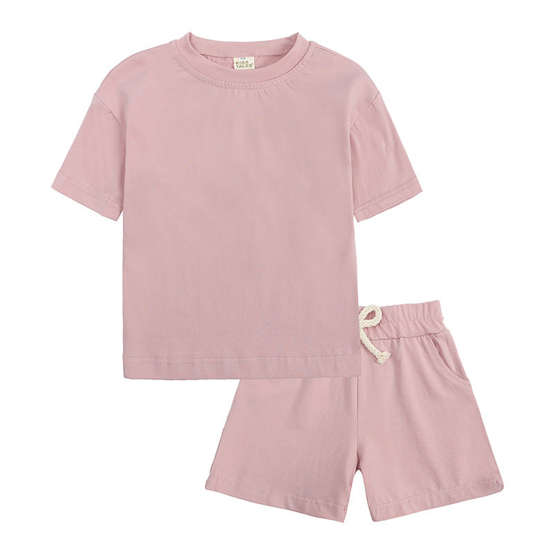 Kid's 2 pc Shorts and T-shirt Sets in soft pink, featuring a short-sleeve tee and matching shorts, perfect for warm summer days.