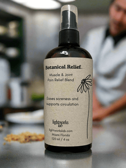 Botanical Relief muscle and joint pain relief blend bottle on a counter with a blurred background