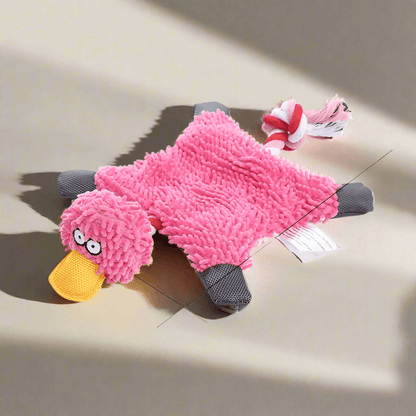 Squeaky Corduroy Chew Toys For Dogs in pink duck shape with plush texture and a rope attached.
