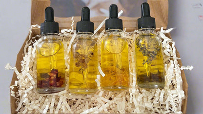 Botanical Dry Body Oil Sampler Set 4x1 oz in recyclable Kraft box with four 1-oz bottles for skin nourishment.