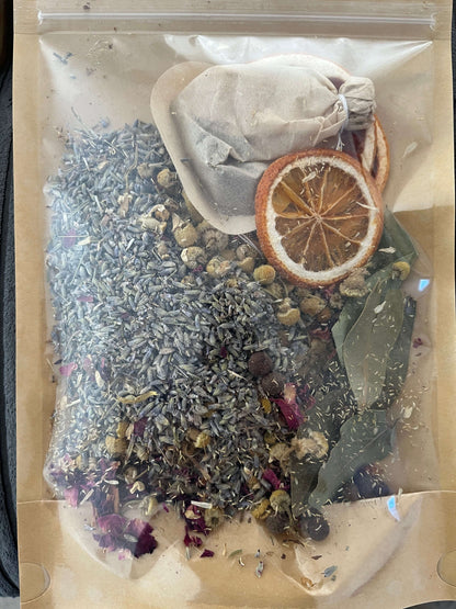 Seasonal Dry or Simmering Potpourris with lavender, dried fruits, and herbal blends in a clear bag.